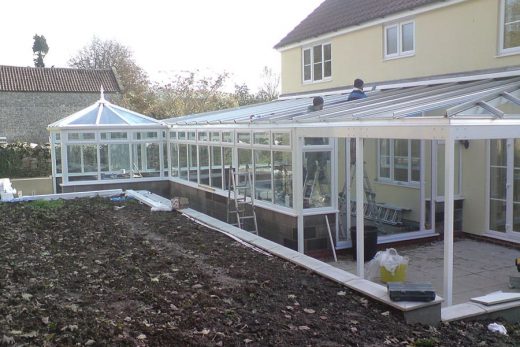 Bespoke white uPVC conservatory being installated