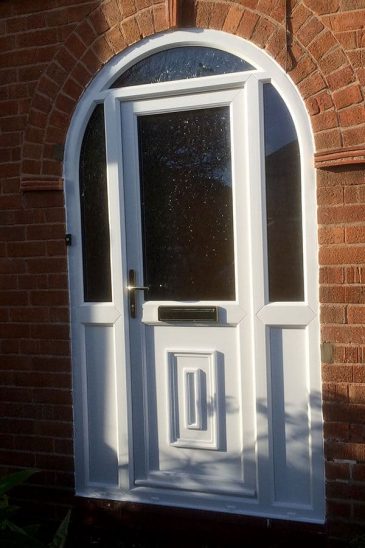 White uPVC entrance door with a bespoke curved frame