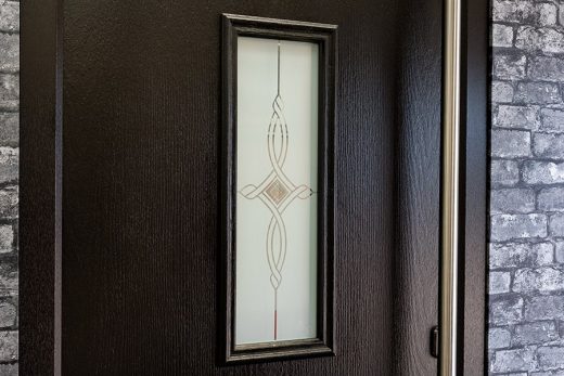 Close up of a black composite door