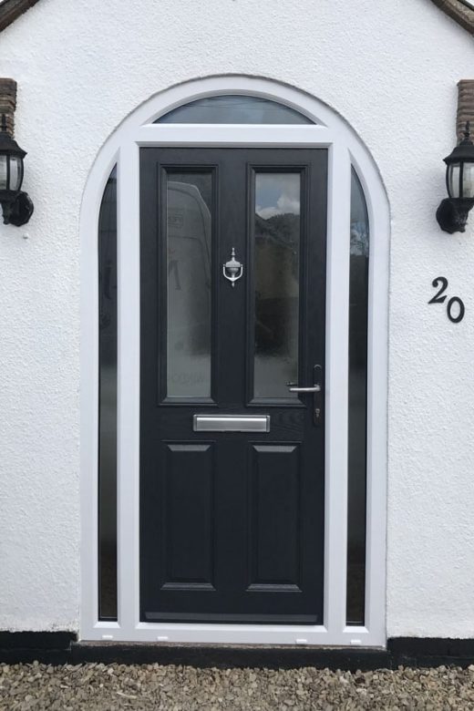 Black composite door with a white frame