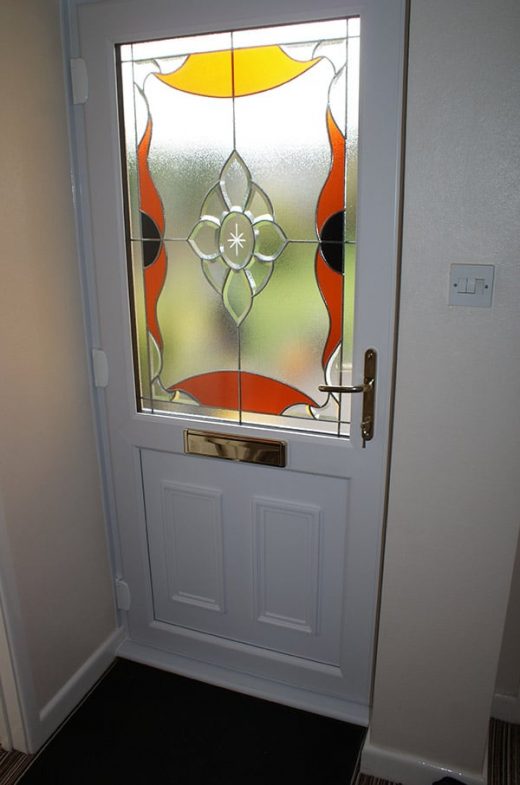 White uPVC entrance door with stained glass
