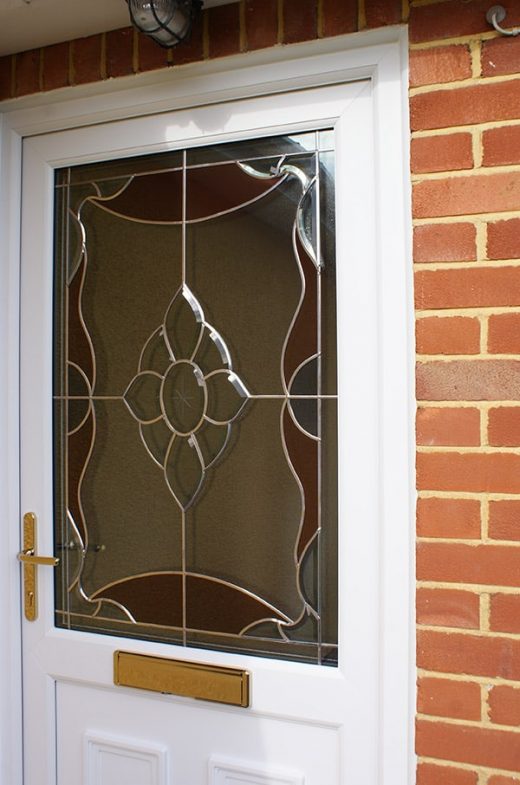 White uPVC entrance door with stained glass