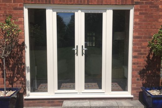 Cream uPVC french door with side windows