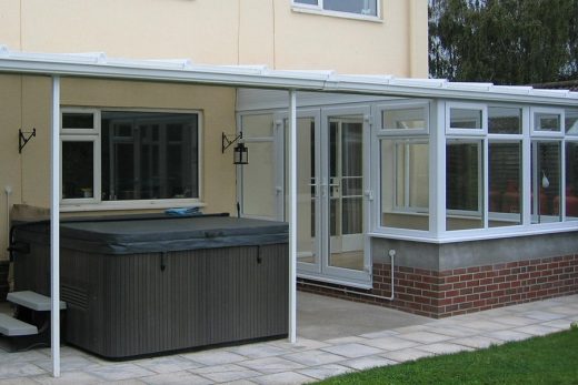 White uPVC lean to conservatory with a veranda