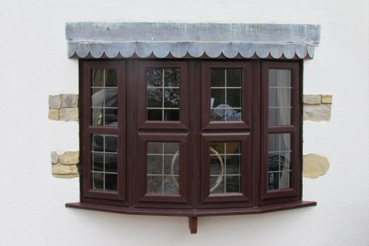 Rosewood effect uPVC bow window