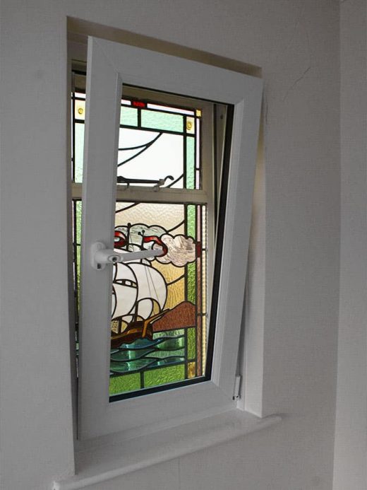 Stained glass window with additional tilt and turn window