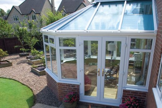 Side view of a white uPVC victorian conservatory