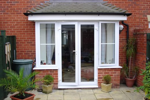 White uPVC french doors with side windows