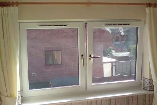Interior view of open white uPVC tilt and turn windows