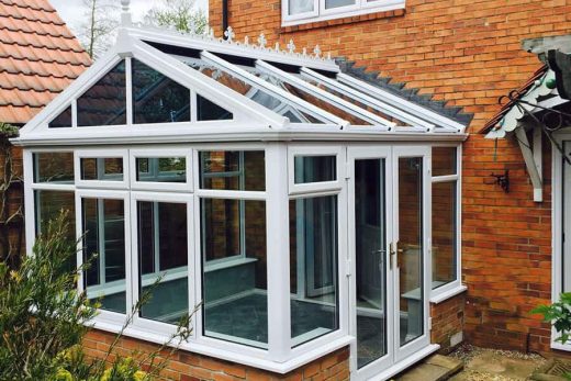 White uPVC gable conservatory with a glass roof