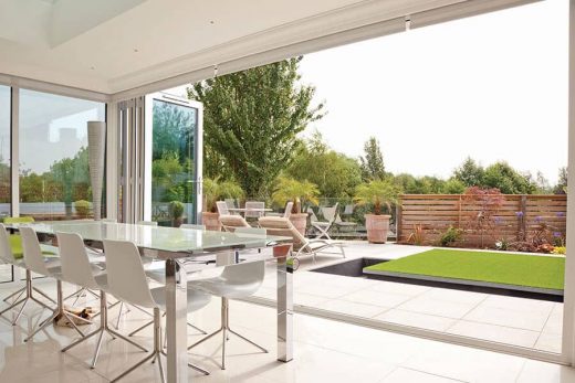 An open white uPVC bifold door