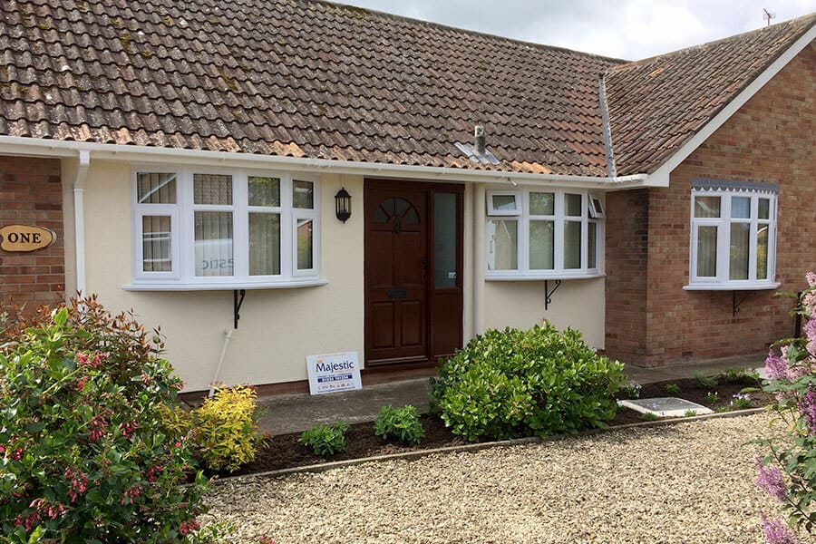 Dual white uPVC bow windows installation