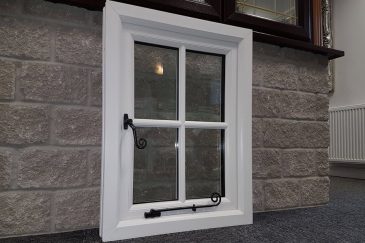 Majestic Designs showroom white uPVC window with monkey tail handles