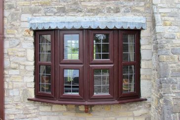 Rosewood effect uPVC bow window