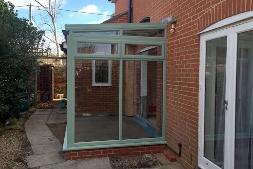 Chartwell green uPVC lean to conservatory side view