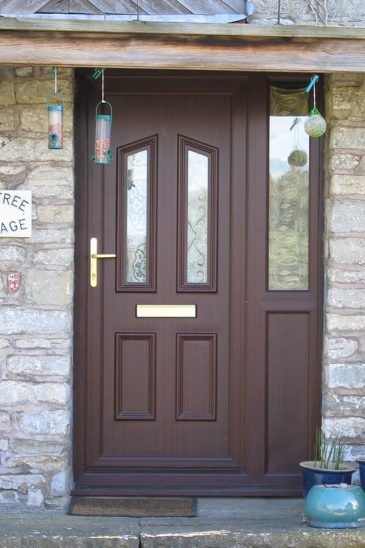 Rosewood effect uPVC entrance door with a side panel