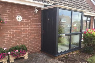 Black uPVC entrance door and porch