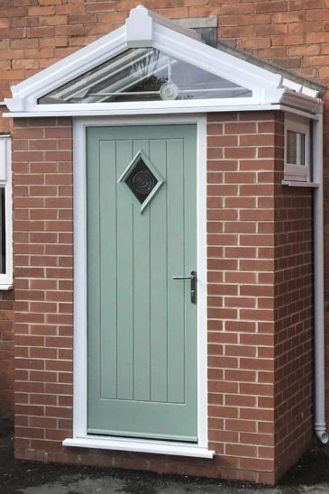 Red brock porch with chartwell green composite door